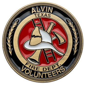 Circular challenge coin for Alvin Texas Fire Dept. Volunteers featuring a white firefighter helmet, red background, and crossed ladder and axe symbols.