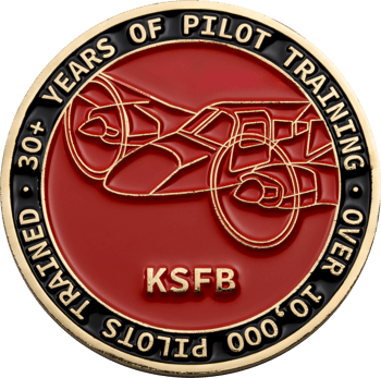 Custom challenge coin featuring KSFB with a twin-engine airplane illustration on red enamel, celebrating 30+ years of pilot training.