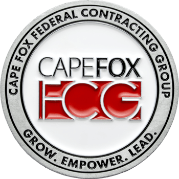 Cape Fox Federal Contracting Group challenge coin with red CFCG logo and silver border.