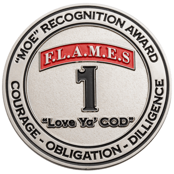 Silver challenge coin with red F.L.A.M.E.S. banner, a large black number one, and text reading MOE Recognition Award.