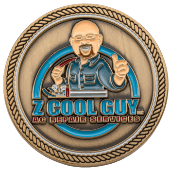 Antique bronze challenge coin featuring a cartoon technician character with blue enamel and the text Z Cool Guy AC Repair Services.