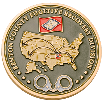 Gold challenge coin featuring the United States map, Arkansas state flag, and handcuffs on a green background.