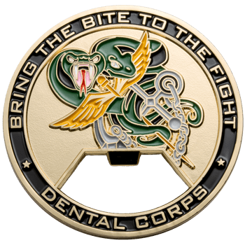 Gold and green challenge coin bottle opener featuring a winged snake and the text Dental Corps and Bring the Bite to the Fight.