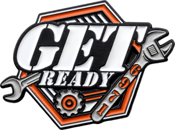 Get Ready lapel pin featuring white and black lettering, orange accents, a gear, and wrenches within a hexagonal border.