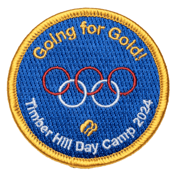 Circular embroidered patch for Timber Hill Day Camp 2024 featuring blue background, gold border, interlocking rings, and Going for Gold text.