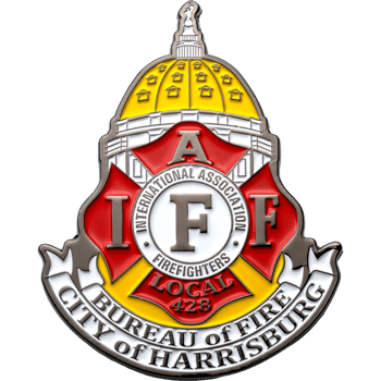 Shield-shaped lapel pin featuring the IAFF logo, Harrisburg City Bureau of Fire text, and a yellow capitol dome illustration.