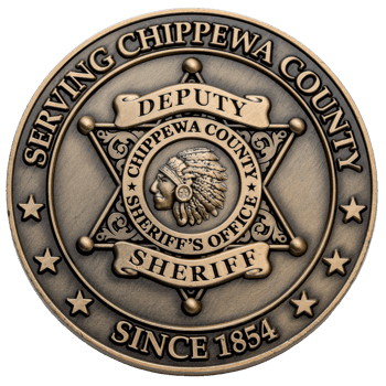 Antiqued bronze challenge coin for the Chippewa County Sheriff's Office featuring a six-pointed star and an emblem with an individual in a traditional headdress