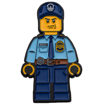 Challenge coin designed as a toy brick figurine wearing a United States Capitol Police uniform with a USCP nameplate and badge.