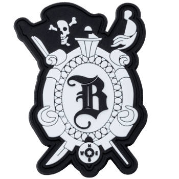 Black and white PVC patch featuring an Old English letter B, skull and crossbones, compass, and crossed swords.