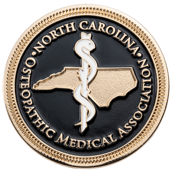 Gold and black pin for the North Carolina Osteopathic Medical Association featuring a Rod of Asclepius and state outline.