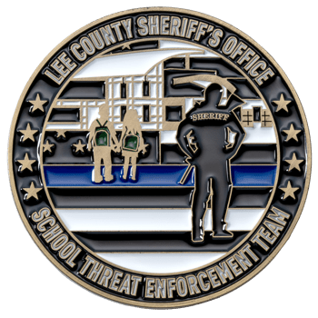 Round challenge coin for Lee County Sheriff's Office School Threat Enforcement Team featuring a sheriff silhouette and children over a thin blue line flag.