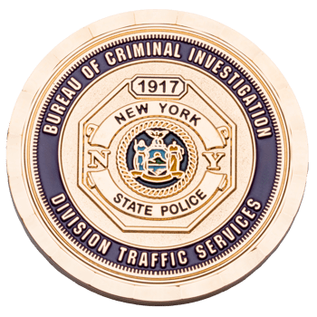Gold challenge coin for the New York State Police Bureau of Criminal Investigation Division Traffic Services featuring the state seal.