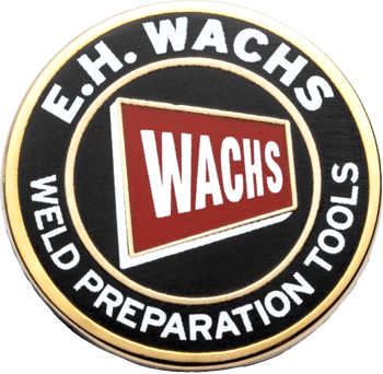 Circular challenge coin featuring E.H. Wachs Weld Preparation Tools text with a red and white Wachs logo on a black background.