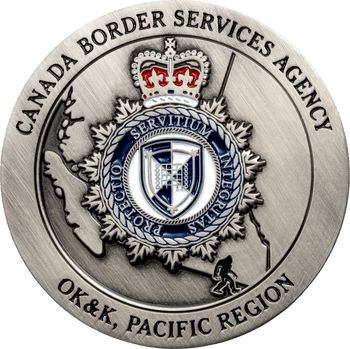 Antique silver challenge coin featuring the Canada Border Services Agency badge, Pacific Region text, and a small Bigfoot silhouette.