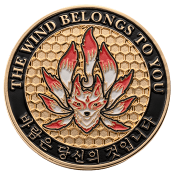 Gold and enamel challenge coin featuring a red and white nine-tailed fox over a gold honeycomb background with English and Korean text on a black border.