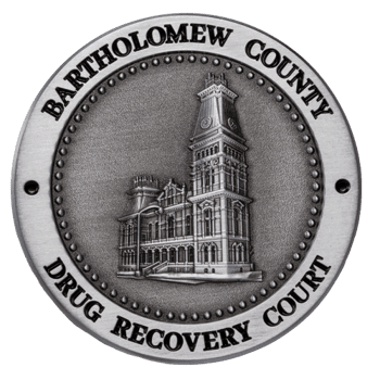 Silver challenge coin featuring an architectural building engraving and the text Bartholomew County Drug Recovery Court.