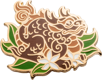 Enamel lapel pin featuring a stylized brown mythical creature with gold outlines, green leaves, and a white flower.