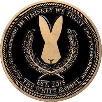 Antique bronze challenge coin featuring a rabbit silhouette, laurel wreath, and the text In Whiskey We Trust The White Rabbit.
