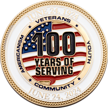 Gold challenge coin celebrating 100 Years of Serving with an American flag background and rope edge detail.