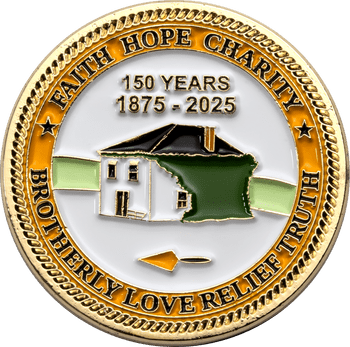 Gold commemorative challenge coin featuring a house emblem, trowel, and inscriptions Faith Hope Charity and Brotherly Love Relief Truth.