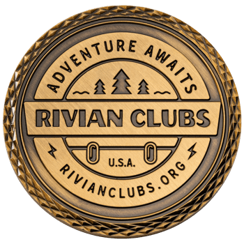 Antique brass challenge coin for Rivian Clubs featuring pine trees, diamond cut edge, and Adventure Awaits text.