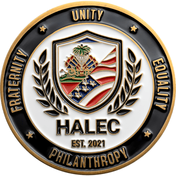 Circular challenge coin featuring HALEC text, a shield with Haitian and American flags, and a black border with Unity, Equality, Philanthropy, and Fraternity.