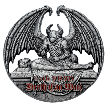 Antiqued silver challenge coin featuring a winged demonic figure over a body on a stone slab with red 67th FRSD text.