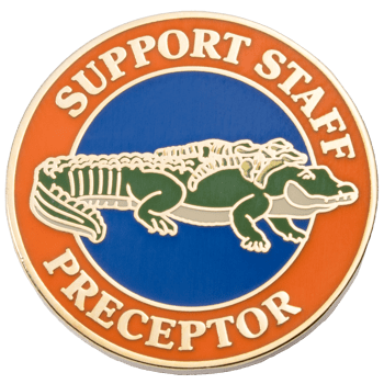 Circular lapel pin featuring a green alligator on a blue background with an orange border reading Support Staff Preceptor.