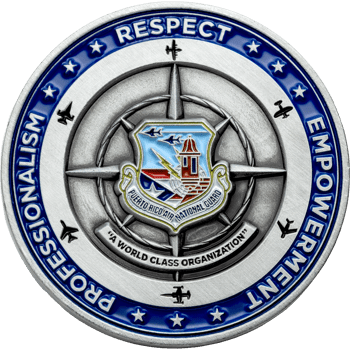 Antiqued silver challenge coin for Puerto Rico Air National Guard featuring a compass rose, aircraft silhouettes, and blue enamel border with stars.