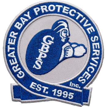 Circular blue and white embroidered patch for Greater Bay Protective Services Inc. featuring a center logo and Est. 1995 text.