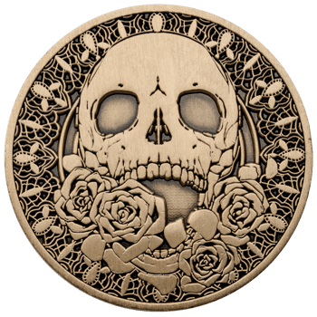 Antiqued gold challenge coin featuring a central skull surrounded by roses and an intricate lace-style cutout border.