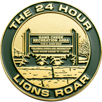 Gold and green challenge coin featuring Gans Creek Recreation Area sign with The 24 Hour Lions Roar text on the outer rim.