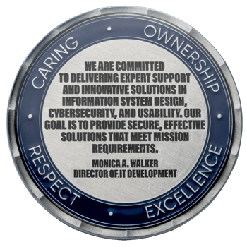 Silver and blue challenge coin featuring a mission statement with the values Caring, Ownership, Respect, and Excellence on the outer border.