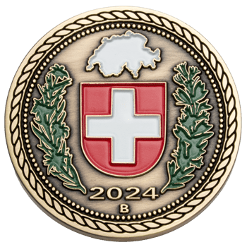 Antique gold challenge coin featuring the Swiss flag shield, a map of Switzerland, green laurel wreaths, and the year 2024.
