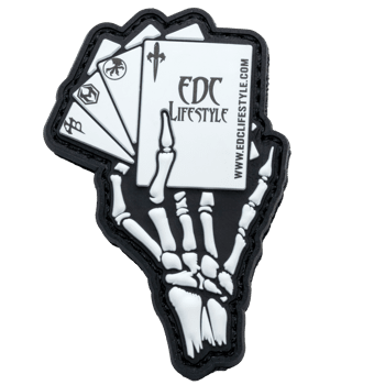 PVC patch featuring a skeleton hand holding a fan of playing cards with EDC Lifestyle branding and logos.