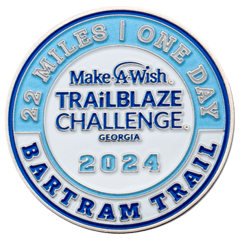 Circular challenge coin for the 2024 Make-A-Wish Trailblaze Challenge Georgia on Bartram Trail featuring blue and white enamel.