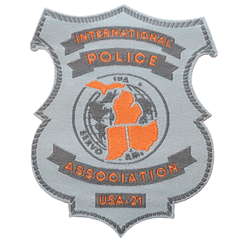 Shield-shaped embroidered patch for the International Police Association USA-21 featuring an orange map of Michigan and a globe on a gray background.