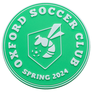 Green and white circular PVC lapel pin for Oxford Soccer Club Spring 2024 featuring a hornet mascot and soccer ball emblem.