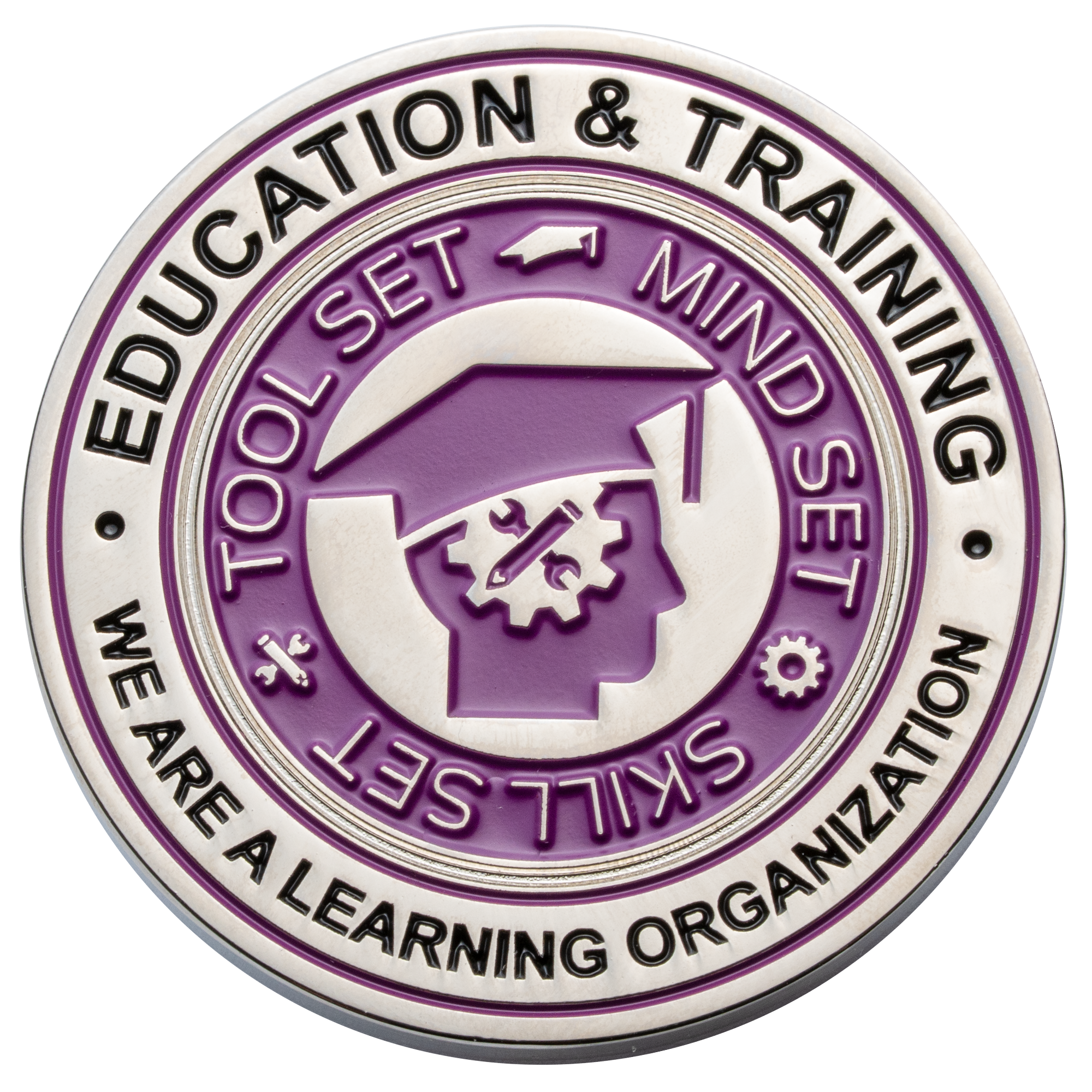Circular silver challenge coin with purple enamel featuring a graduation cap icon and 'Education & Training' text.