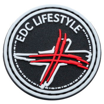 Circular PVC patch featuring EDC Lifestyle text and a stylized red and white cross on a black textured background.